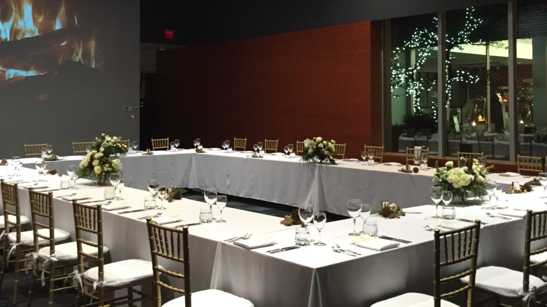 event venue and meeting space showing banquet tables and chairs set for dining.