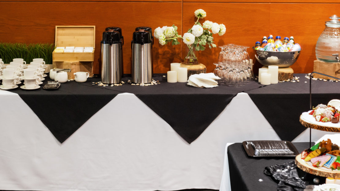event venue and meeting space showing buffet table with food and decorations.